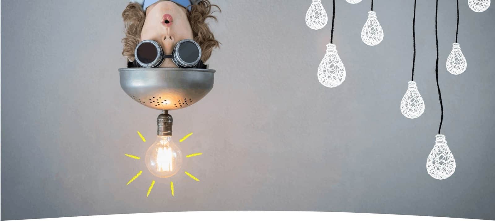 A learner upside-down with lightbulbs