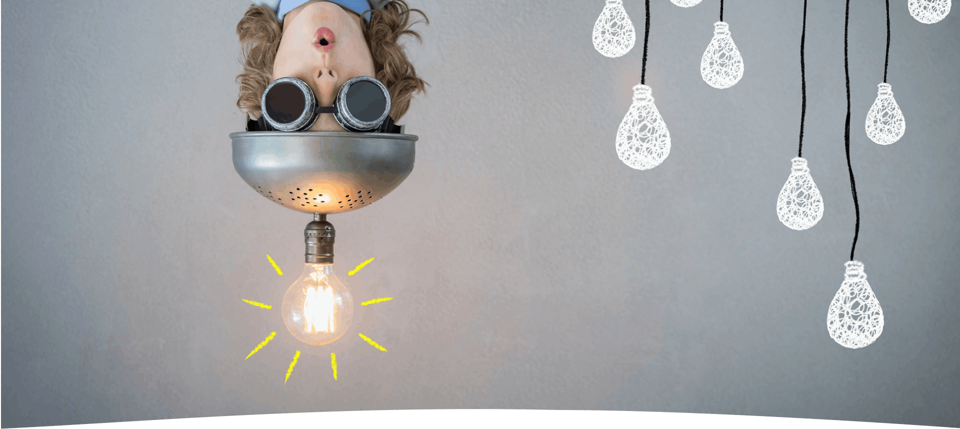 A learner upside-down with lightbulbs